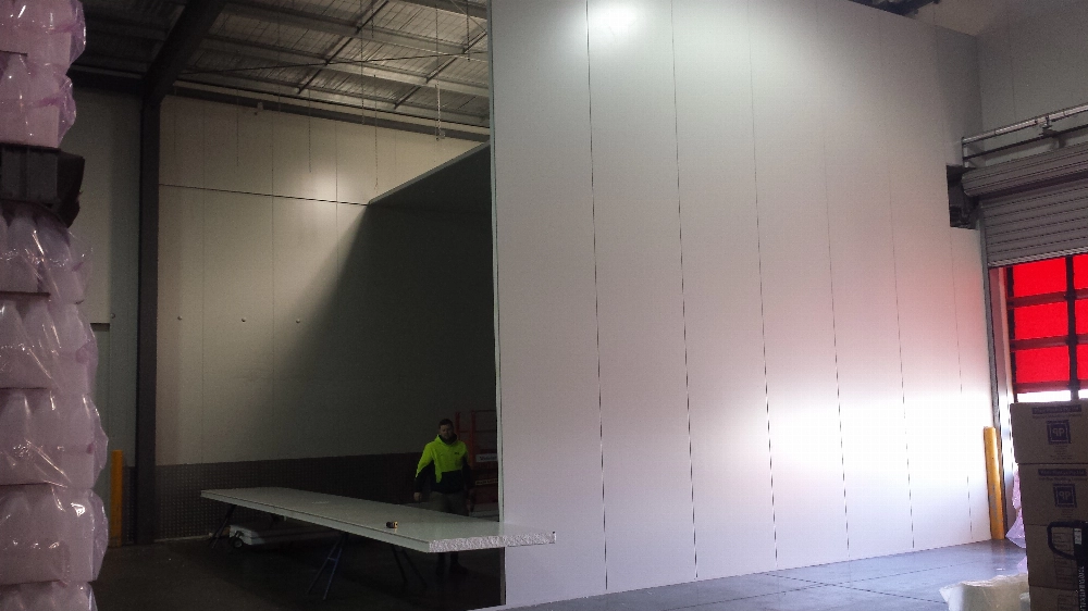 Essential tools for cutting coolroom panels: measuring tape, straight edge, utility knife, saw blade and safety equipment
